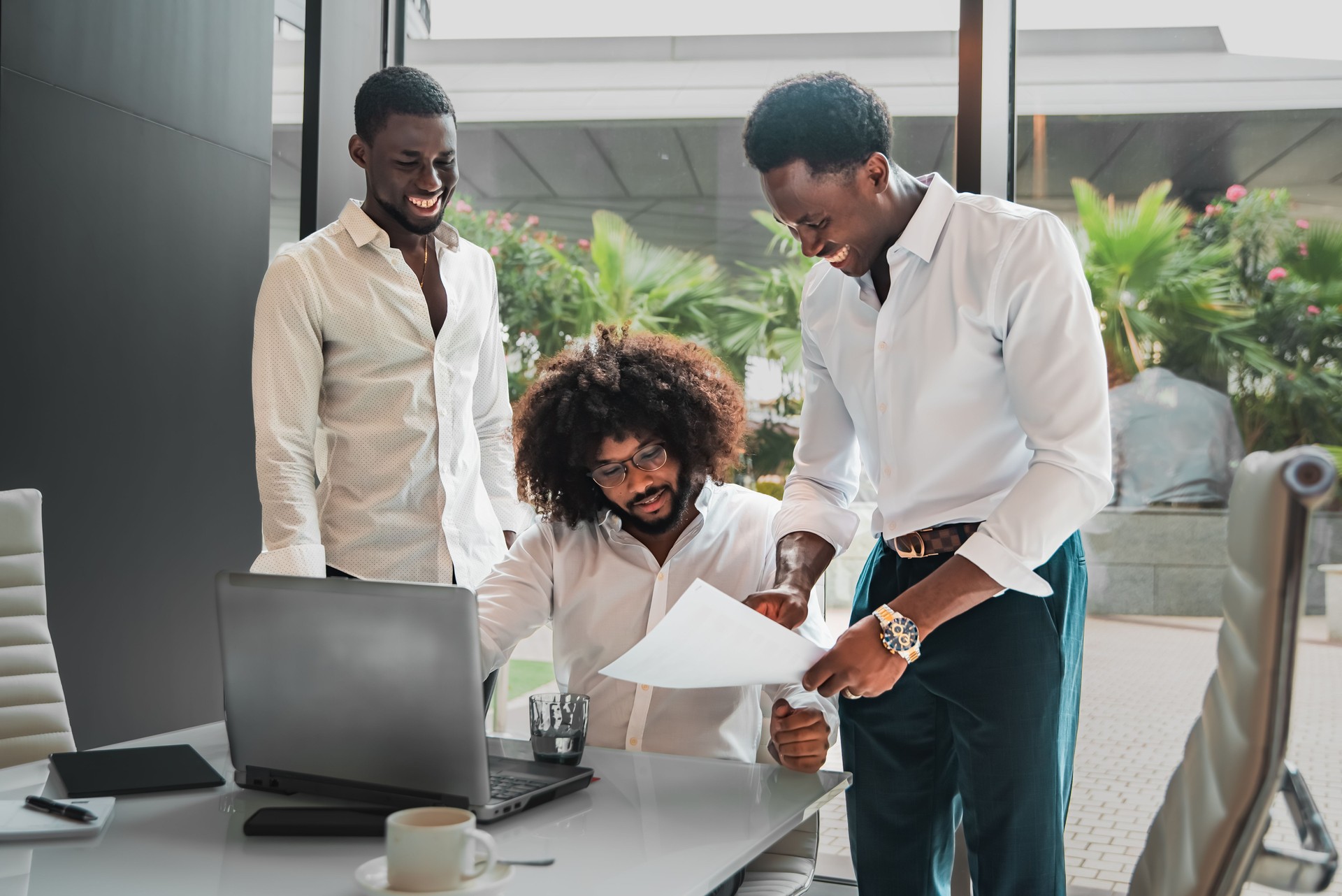 Group of smiling young Multiethnic business executives at a meeting discussing a work
